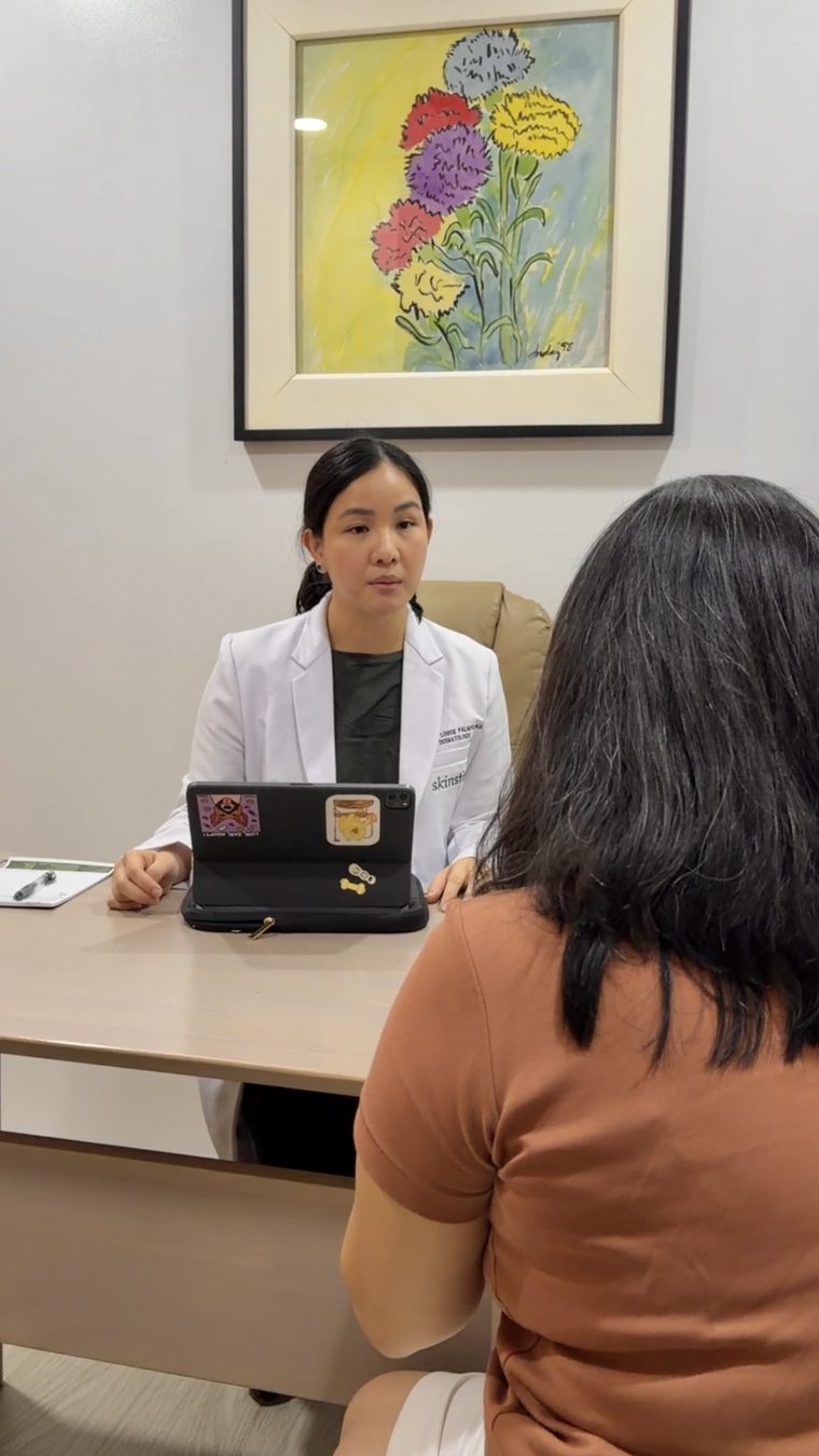 Dr. Charlene Palafox discussing facial treatment options with a patient at Skinstitute.
